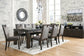 Hyndell Dining Table and 8 Chairs with Storage at Walker Mattress and Furniture Locations in Cedar Park and Belton TX.