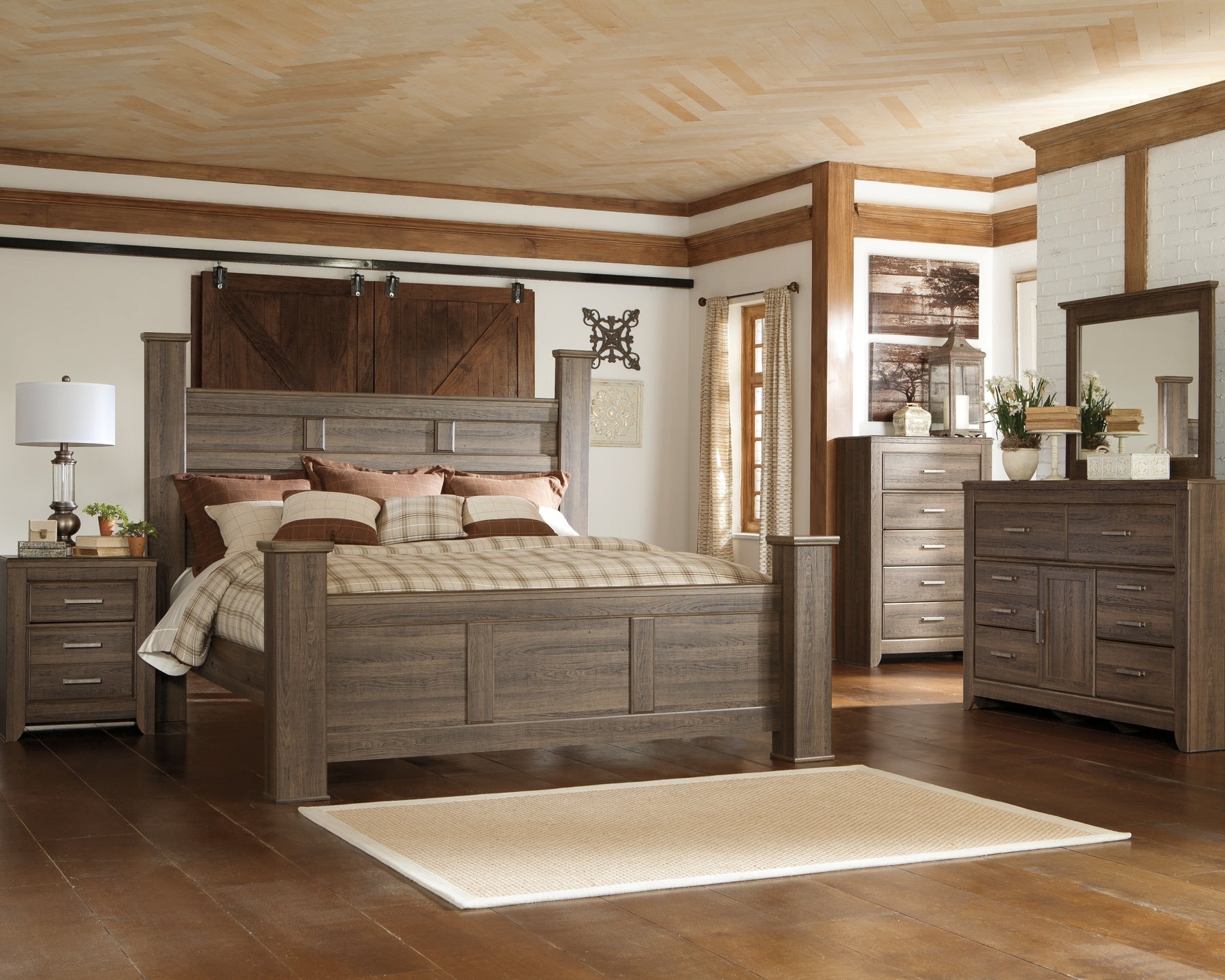 Juararo King Poster Bed with Mirrored Dresser and Chest at Walker Mattress and Furniture Locations in Cedar Park and Belton TX.